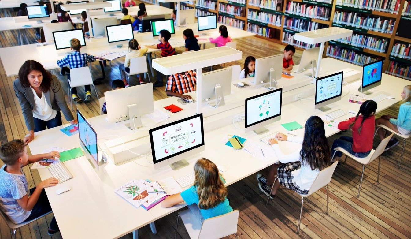 Students in a computer lab representing Homeschool and PEP Instructional Services